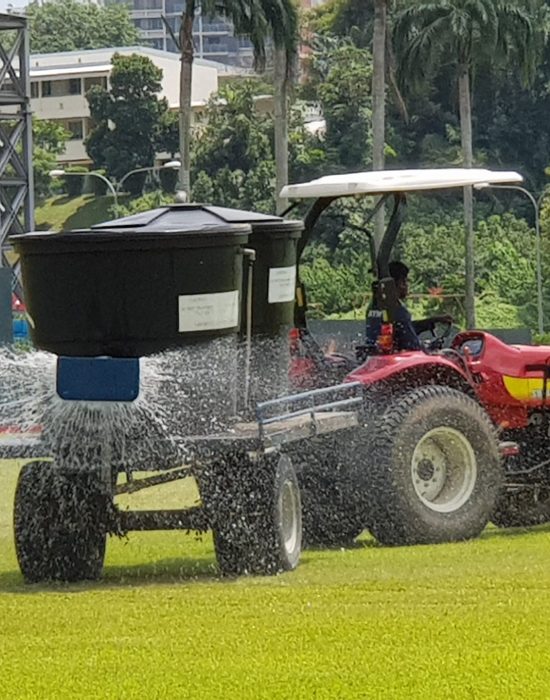 Water tanker irrigating polo field